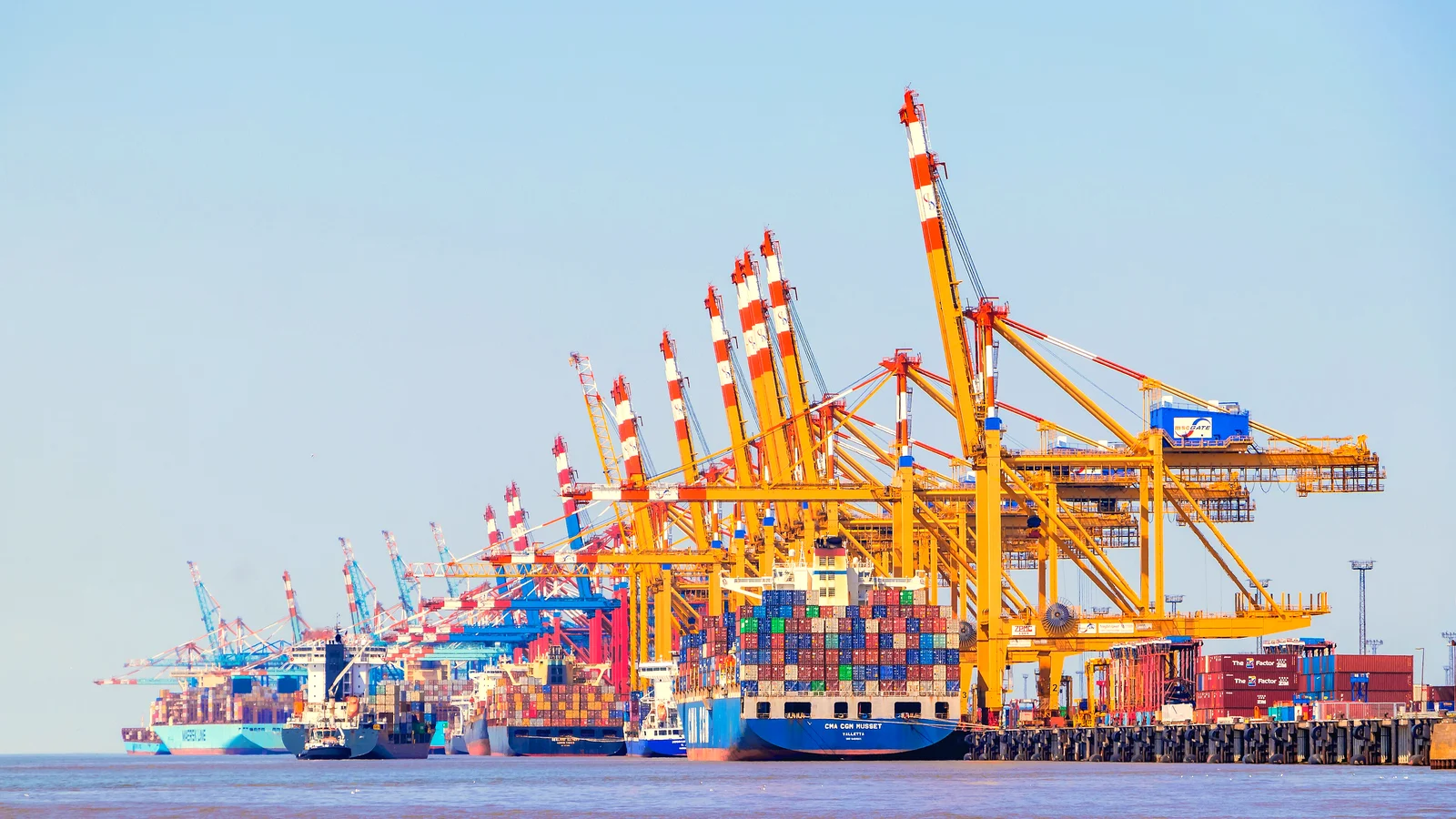 Container cranes and a loaded container ship at the Bremerhaven terminal