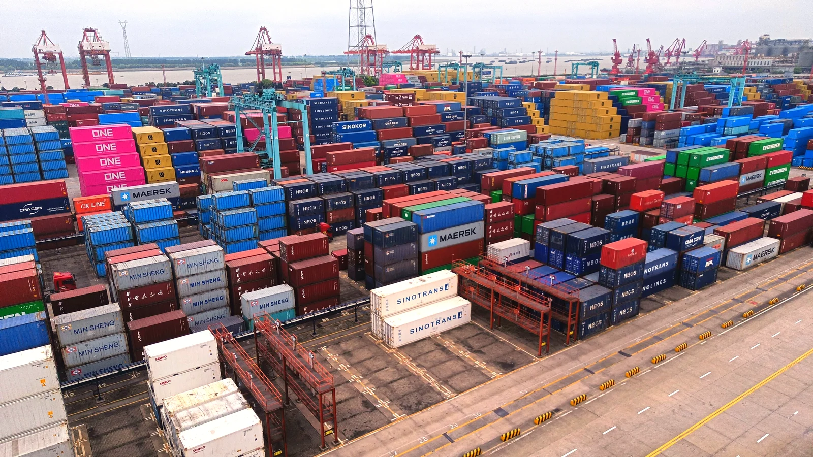 Aerial view of container stacks and quay cranes at the Zhangjiagang container terminal