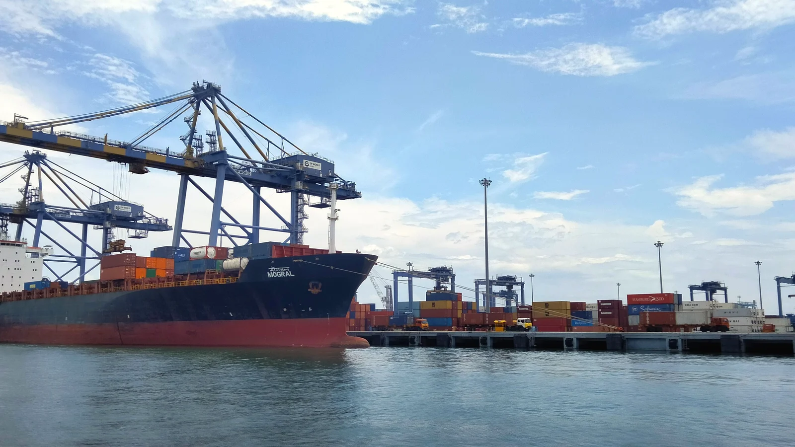 Container ship at a quay with cranes at the Vallarpadam transshipment terminal in Kochi, India