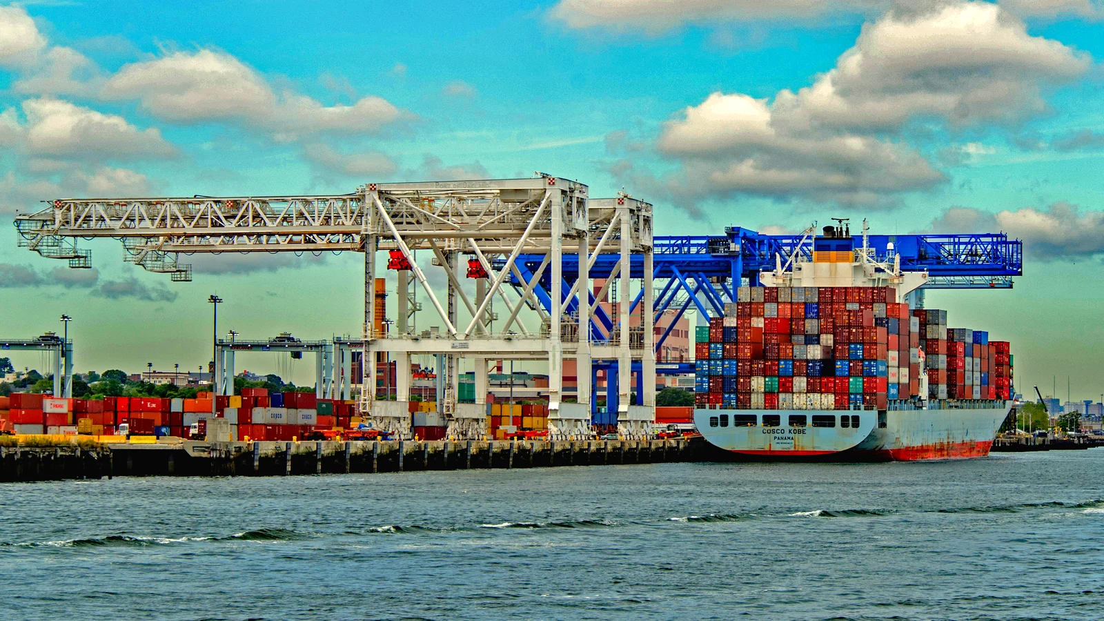 Loaded container ship berthed under gantry cranes at Conley Terminal, Boston