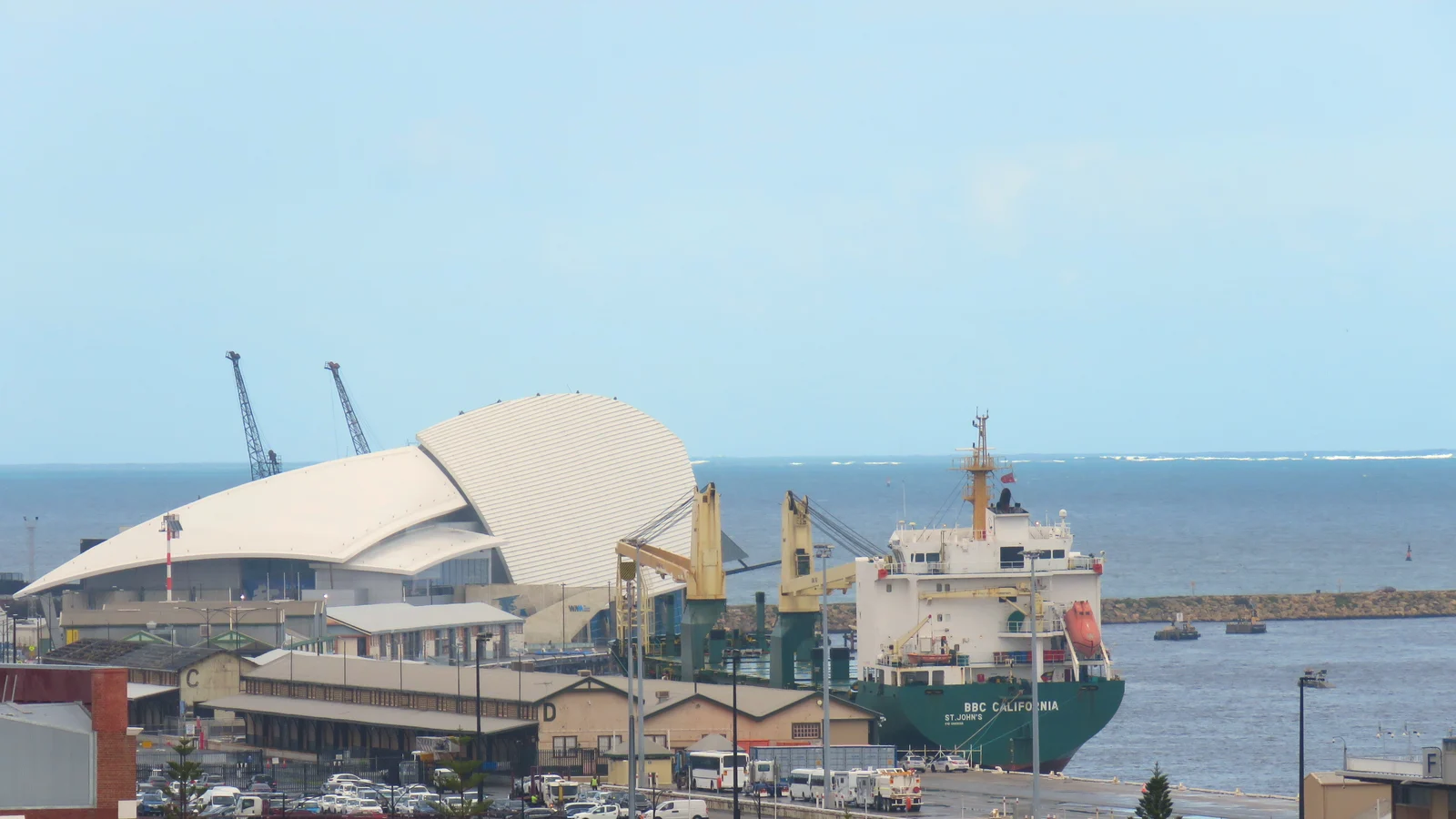 General cargo ship in Fremantle Harbour under a clear blue sky