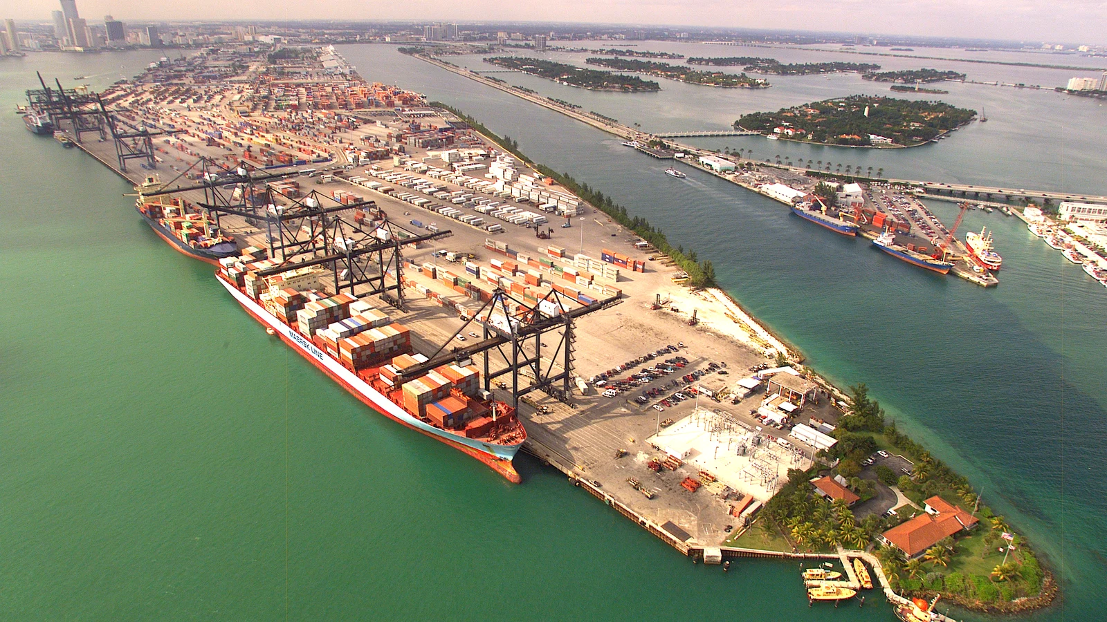 Aerial view of the Port of Miami container terminal with ships, cranes and container stacks