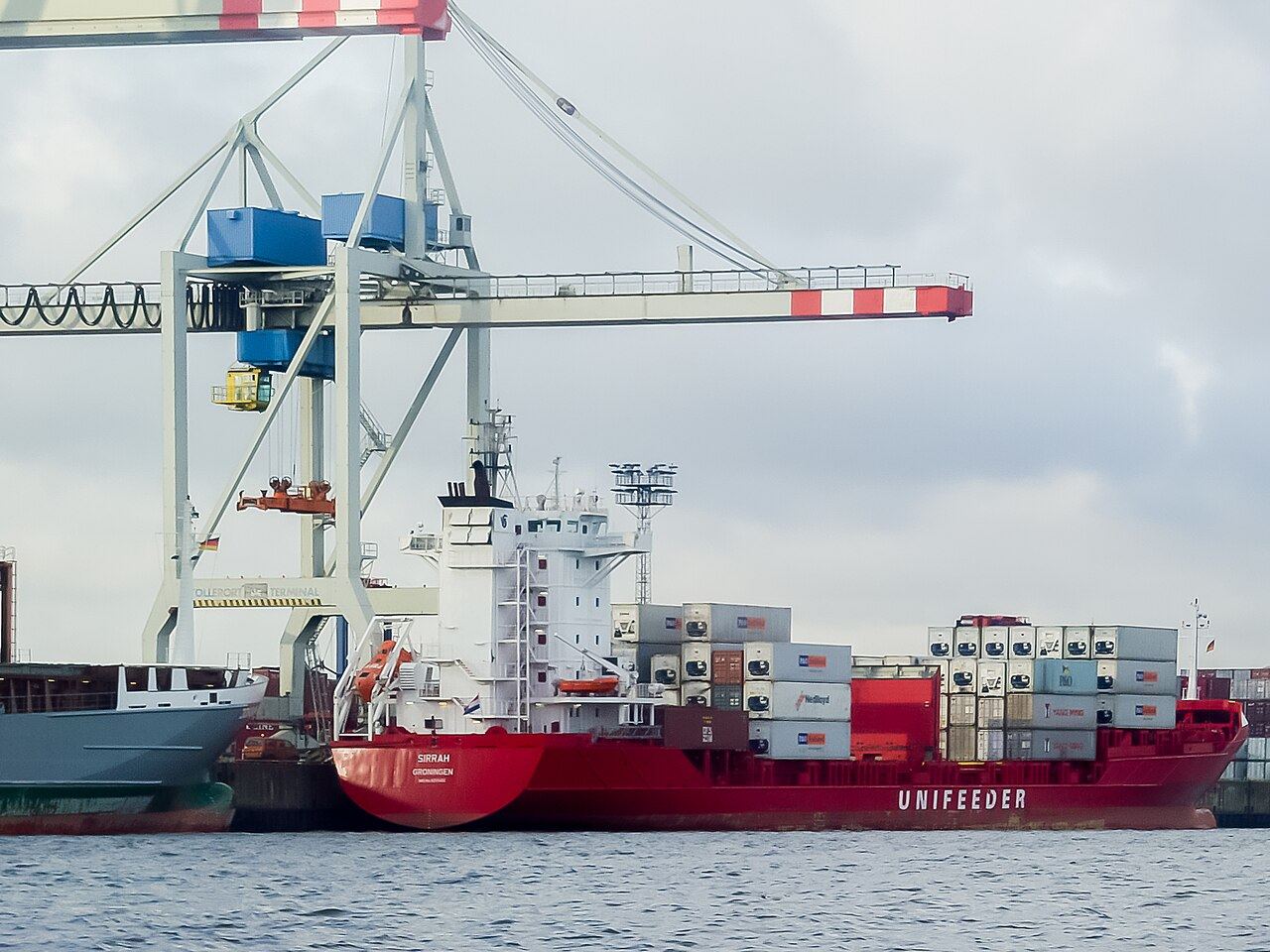 Container ship Sirrah, IMO 9255402, Unifeeder at container terminal Tollerot, port of Hamburg-1029240