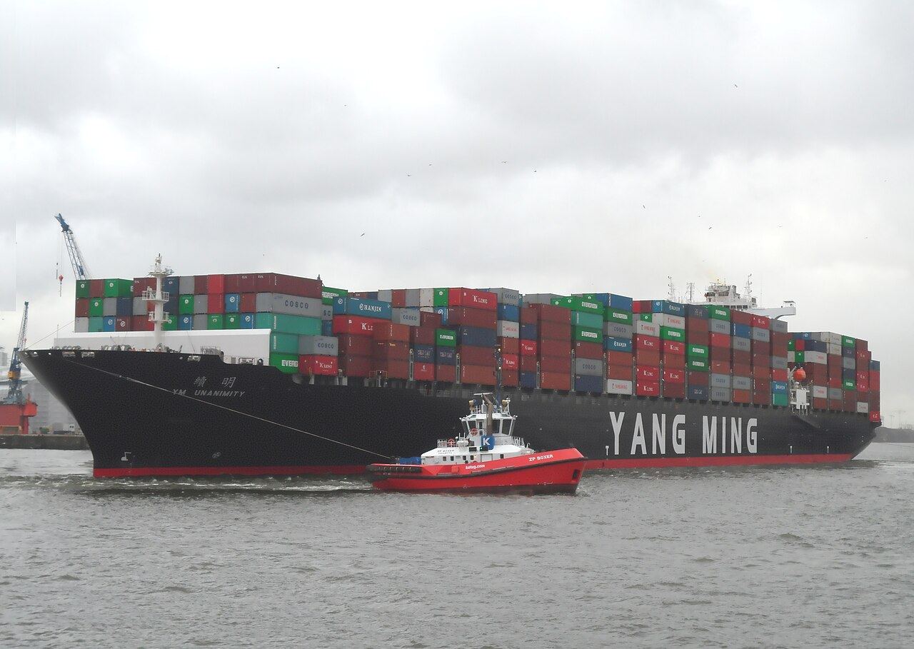 Container ship YM Unanimity of Yang Ming Line when turning in the port of Hamburg in December 2013